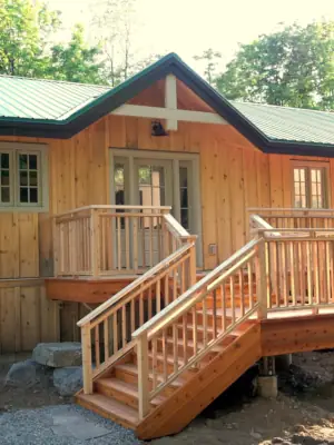 A quality steel roof and high-quality (yet cost-effective) windows and doors give this custom home durable aesthetic appeal.