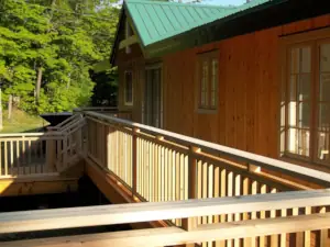 Cruciform finials decorate the gable ends of the cottage and are clad in aluminum sheet metal to give them durability against weather.