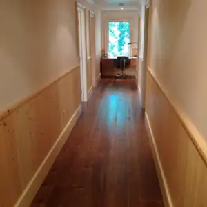 The upper level incorporates four sleeping rooms, a common bathroom and a laundry room on the same level.