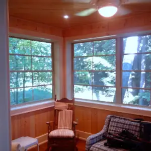 The three season Porch offers a private space away from the common areas of this cottage design to allow sanctuary during large family events.