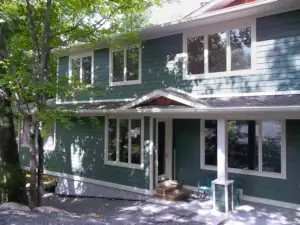 This large cottage design incorporates 5 bedrooms, 2 bathrooms, a Muskoka Room and a three season Porch.