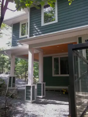 The Muskoka Room and a deck overlooking Leonard Lake are both accessible from the driveway via a sheltered outdoor circulation path.  
