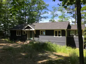 The view from the driveway makes this home look like a single-level bungalow but it is a two-level home design including a walkout basment