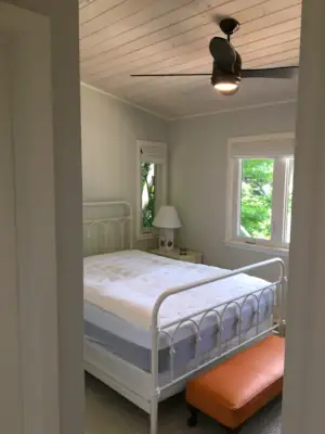 The Master Bedroom benefits from a direct view over Lake Muskoka and connects with an ensuite Master Bath.