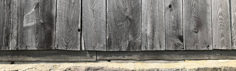 Aged, rustic, reclaimed and silver-coloured barn board is a commonly sought-after interior woodwork finish for waterfront luxury homes and cottages located in Muskoka, Ontario.